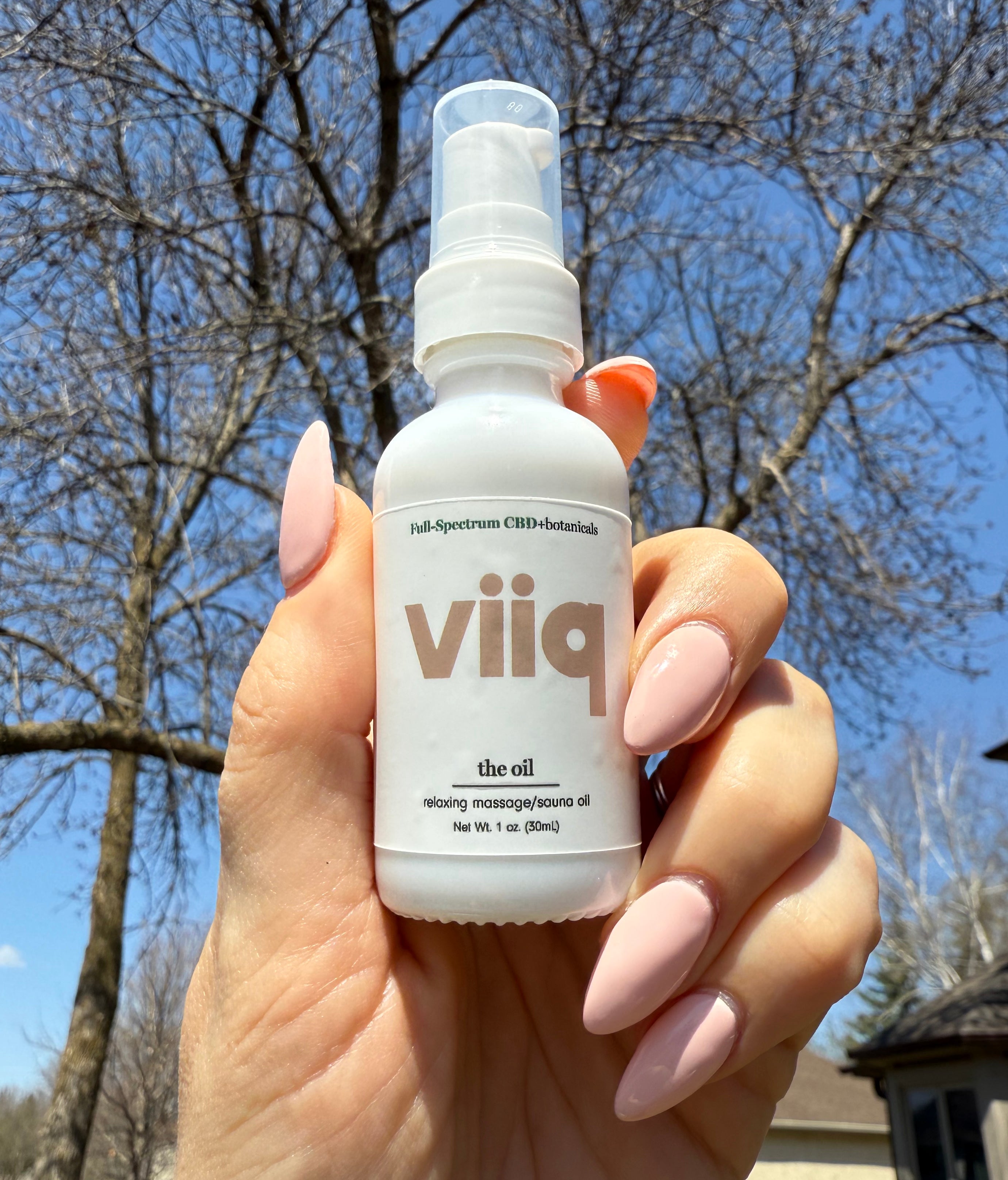 1oz white glass pump bottle Full Spectrum CBD and botanical VIIQ in nude color The Oil relaxing massage/sauna oil