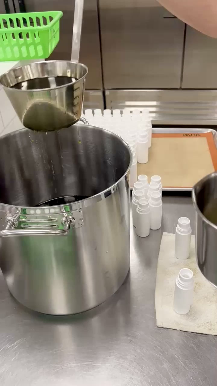 Load video: Made in small batches - stirring oil in stainless steel pot