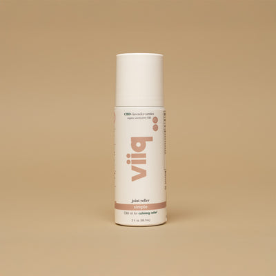 White 3oz roller dispenser bottle with nude VIIQ logo printed vertically CBD oil for calming relief no botanicals for sensitive skin