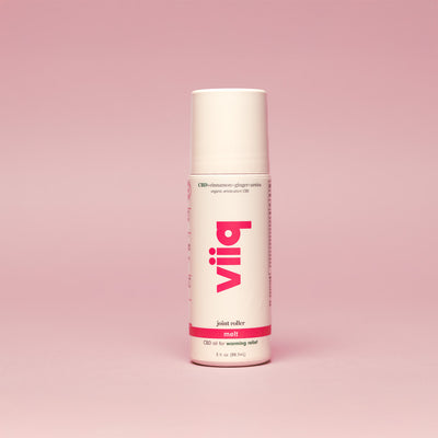 White 3oz roller bottle on pink background with VIIQ logo vertically printed CBD oil or warming relie